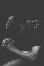 A man kneeling in prayer 