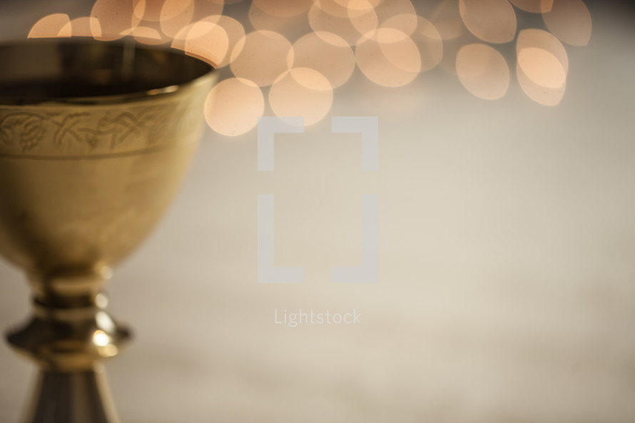bokeh lights behind a chalice 