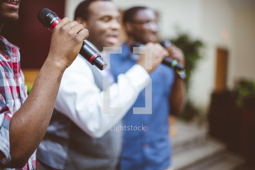 men singing during a worship service 