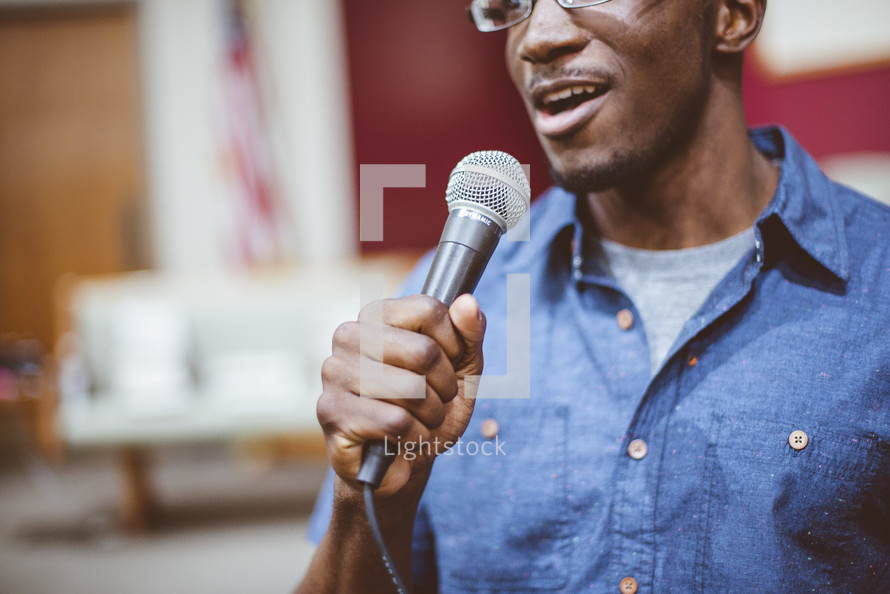 a man holding a microphone 