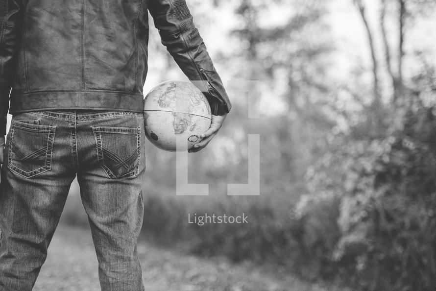 man holding a globe