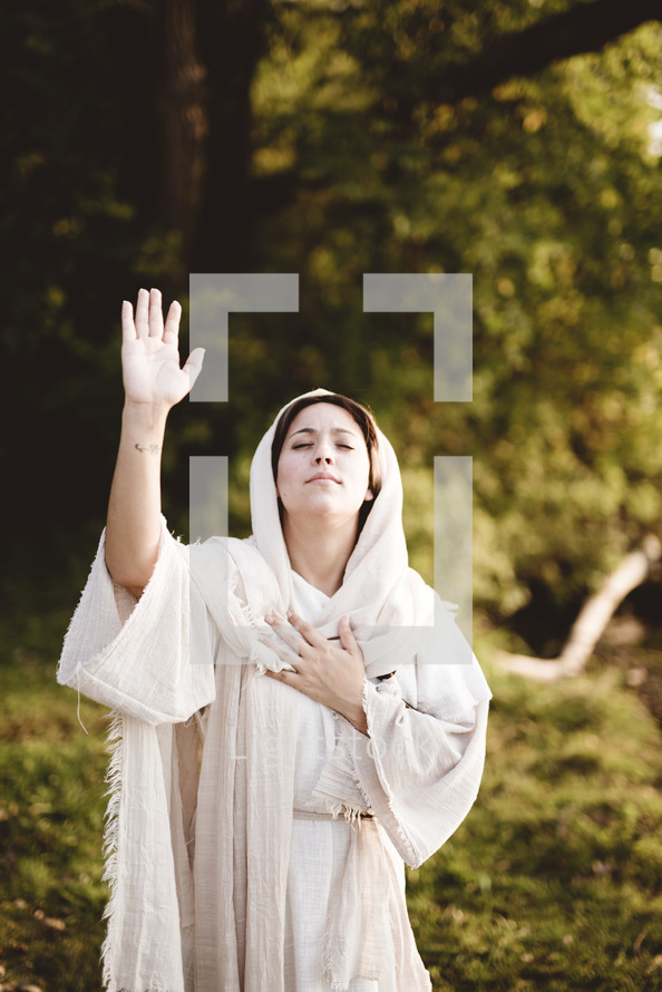 woman praying on her knees in biblical times 