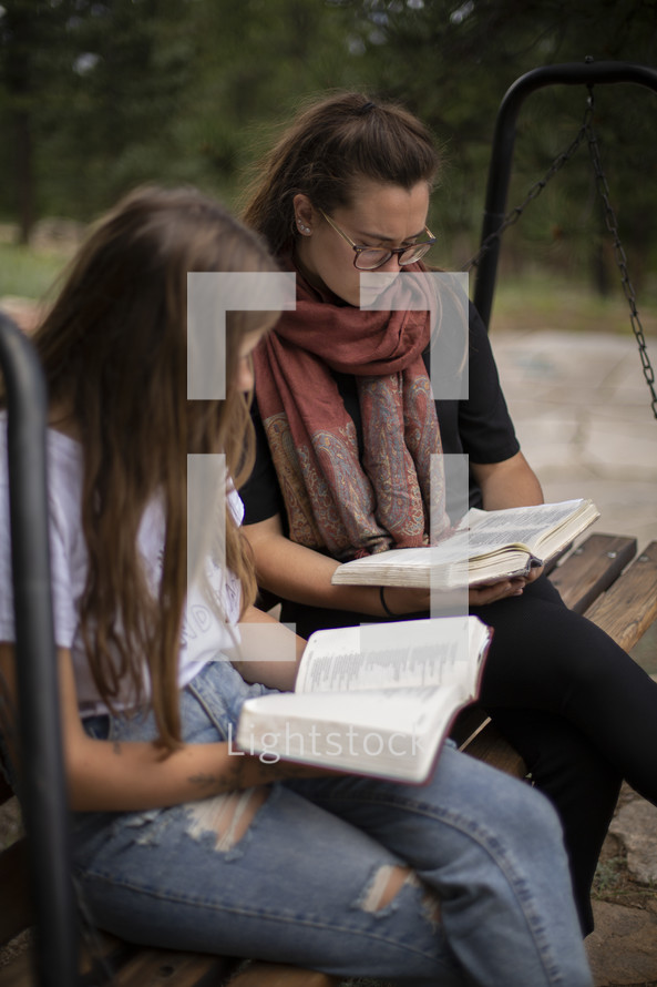 teen girls reading Bibles 