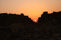old fortress walls and sun at sunset 