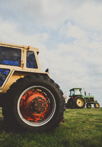 Tractors in a field.