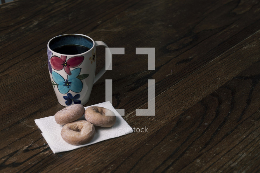 coffee and donuts on a napkin 