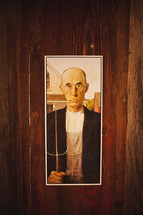Half of American Gothic painting by Grant Wood; Painting of farmer with pitchfork