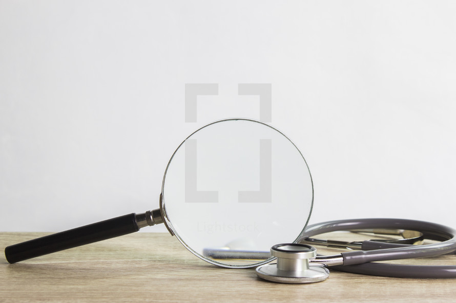 magnifying glass and stethoscope 