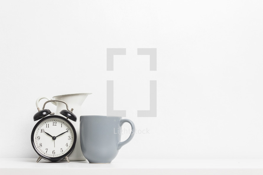 alarm clock and mug 