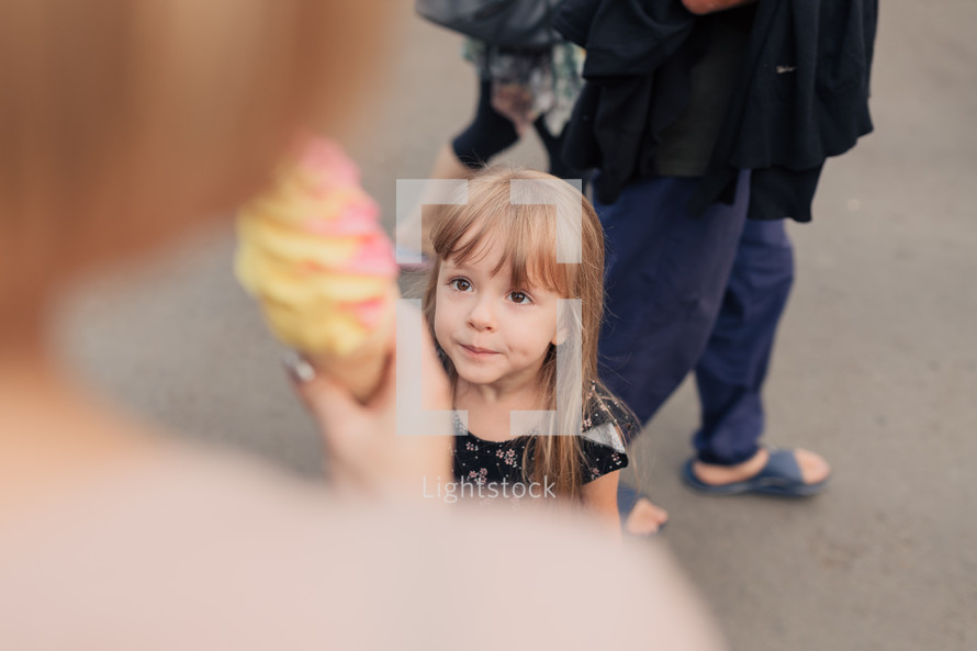 child getting an ice cream cone 