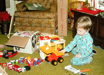 vintage image of a child playing with toys Christmas morning 
