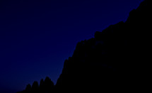 silhouette of a mountain at night