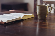open Bible and a cup of coffee