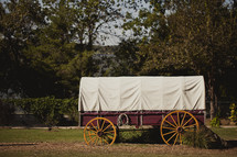 Covered wagon in park.