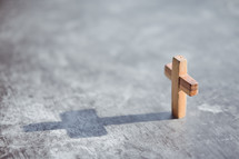 small wooden cross with shadow 