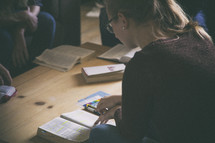people and Bibles on a coffee at a Bible study 