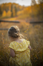 girl in a field in fall 