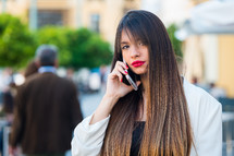 a woman talking on a cellphone 
