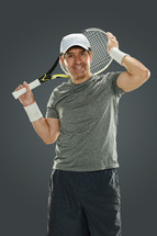 a man holding a tennis racket 