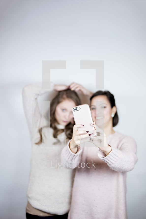 selfies - mother and teen daughter portrait 