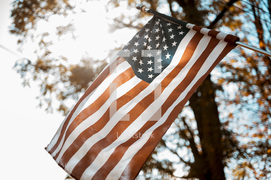 sunlight glowing on an American flag 