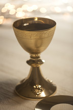 chalice and host with bokeh lights 