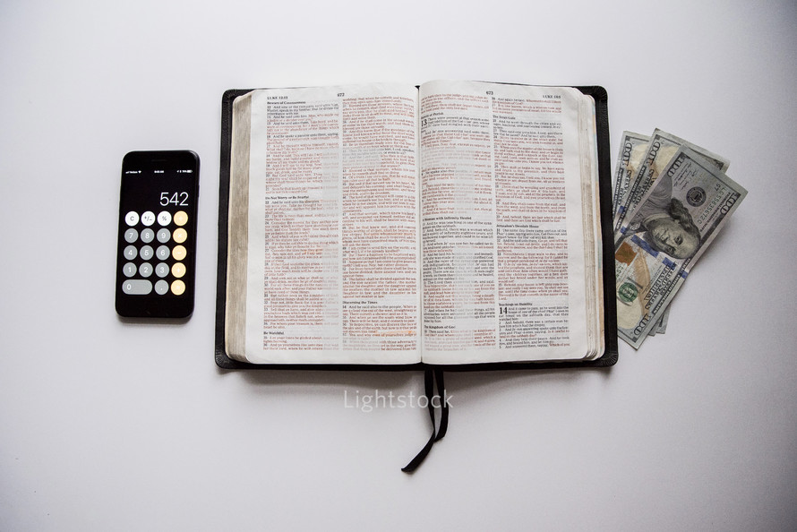 calculator, cash, and Bible 
