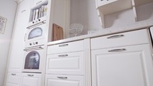 Tracking shot of a luxury kitchen with white classic design