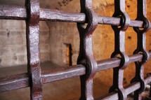 Prison bars on a underground torture cell 