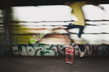 ten boy doing tricks on a skateboard