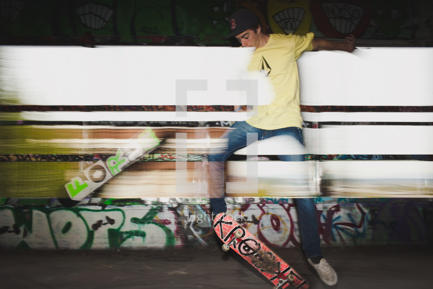teen boy doing tricks on a skateboard