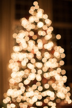 bokeh white lights on a Christmas tree