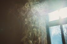 smoke in front of a window 