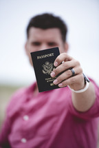 man holding a passport 