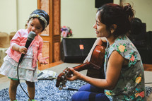 mother and daughter playing music 