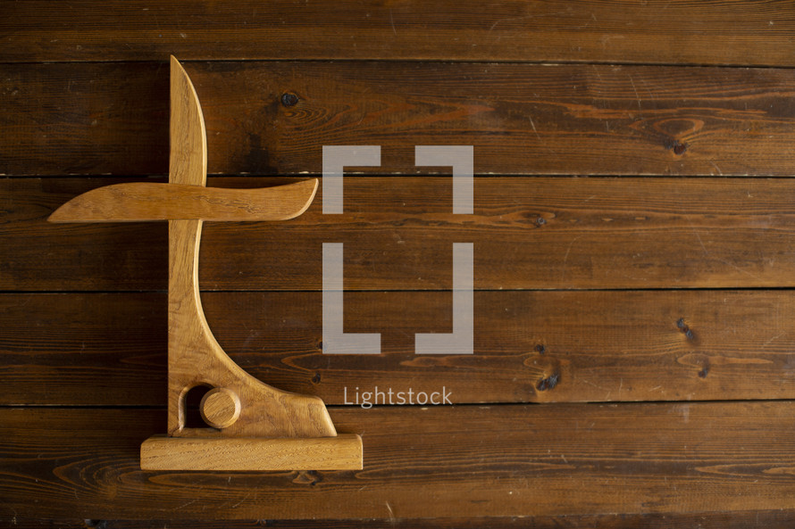 carved cross and empty tomb out of wood 