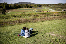Little girls playing on a hill in the fall