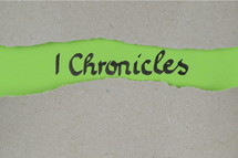 Title 1 Chronicles - torn open kraft paper over green paper with the name of the first book of Chronicles