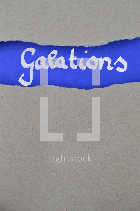 Galatians - torn open kraft paper over intense blue paper with the name of the letter from Paul to the Galations
