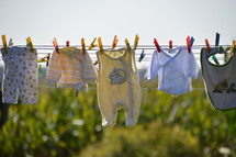 baby clothes drying at a laundry line. 