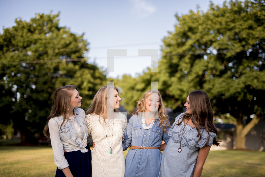 group of smiling women outdoors 
