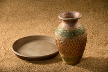 Vintage pottery urn and plate.
