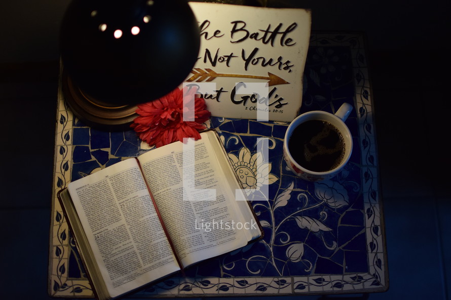 The battle is not yours but God's, and open Bible on a table 