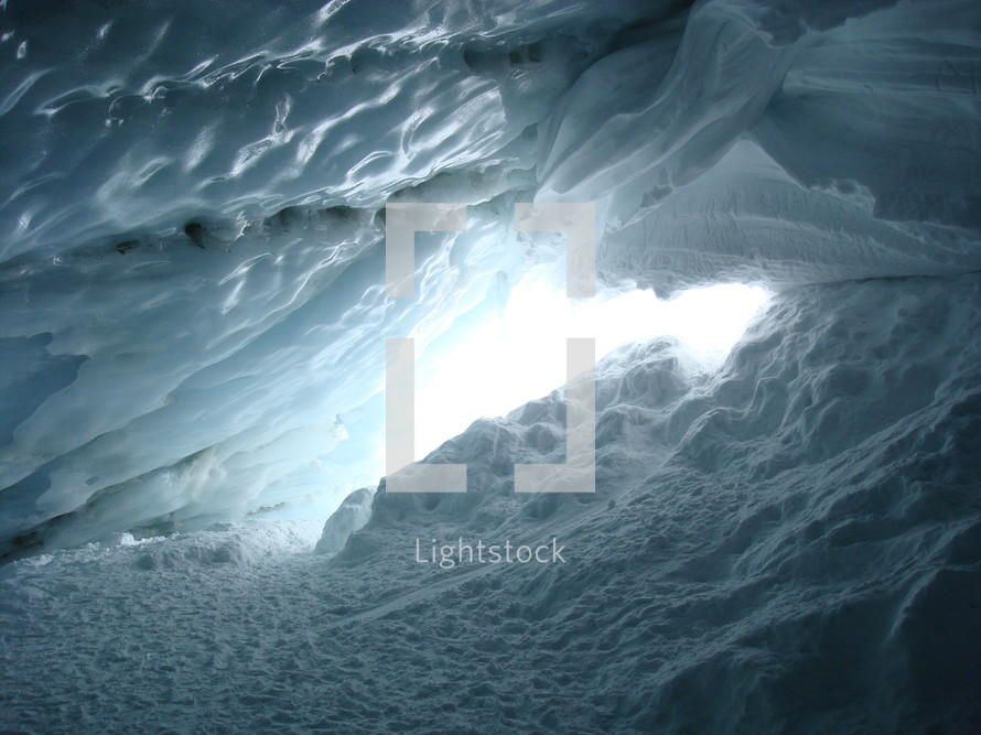 view out of a glacier cave,
cave, glacier, ice, winter, blue, sunshine, light, hollow, cavern, hole, grave, tomb, snow, cold, cool, frost, freeze, dead, death, shiny, radiant, glossy, sparkling, brilliant, bright, gleaming, open, exit, way out, inside