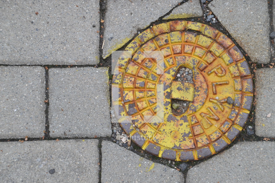 rusty metal man hole cover 