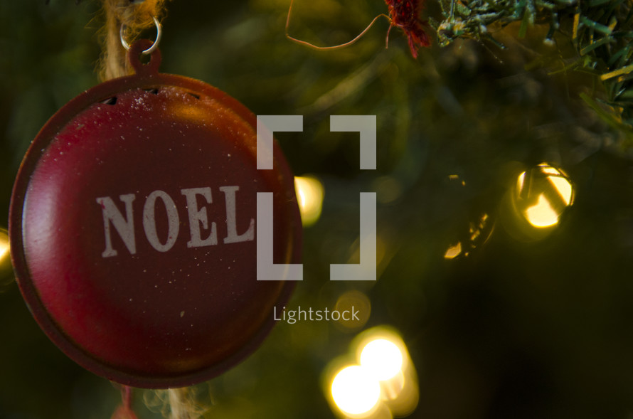Noel ornament on a Christmas tree