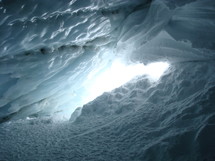 view out of a glacier cave,
cave, glacier, ice, winter, blue, sunshine, light, hollow, cavern, hole, grave, tomb, snow, cold, cool, frost, freeze, dead, death, shiny, radiant, glossy, sparkling, brilliant, bright, gleaming, open, exit, way out, inside