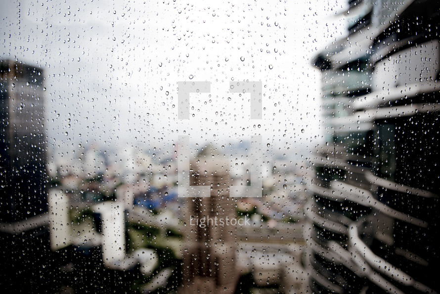 wet glass and city view 
