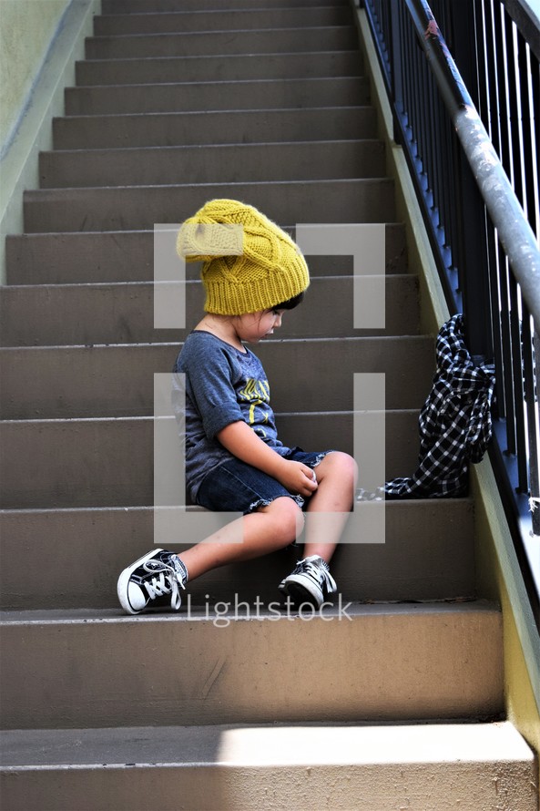 a girl sitting on steps 