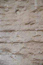 A whitewashed, textured wall. 
whitewashed, wall, industrial, building, background, texture, white, dirty, dirt, grime, industry, manufacture, hall, mural, stone, stones